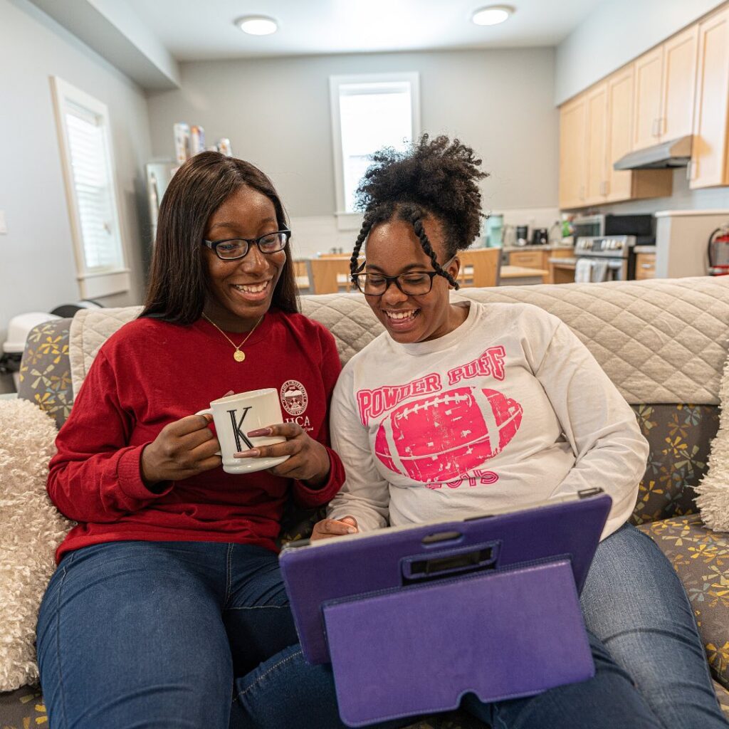 Two students looking at computer